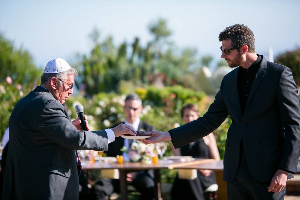 Handing off bread for blessing