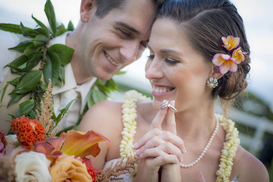 Journalistic natural formal photograph of bride and groom in Hawaii for their destination wedding at Kualoa Ranch on Oahu.