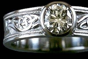 Custom 14kw bezel set diamond engagement ring with Celtic tree of life knot work.