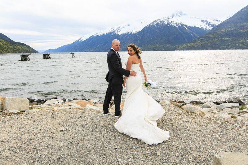 Classic Bride and Groom looking back photo, by Shannon McGuire of Chugach Peaks Photography.