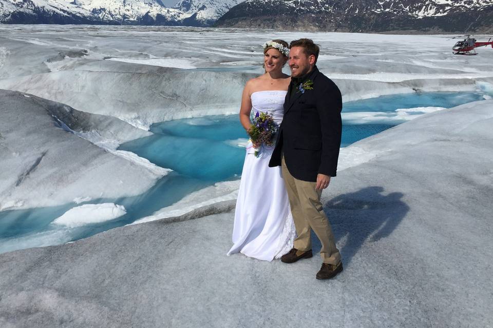 Bride n Groom look on.Photo by Becky McGill Mull of Azure Alaska Weddings.