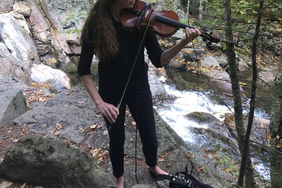 Solo performance at a waterfall wedding