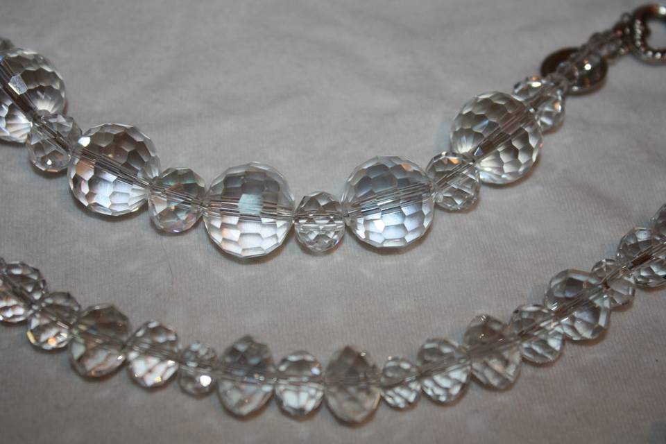 Custom design with unique combination of varying sizes of round faceted clear glass crystals for beautiful beaded necklace, earrings and bracelet for the Bride or bridal party in any style and length,at affordable prices. All Renee needs is YOUR wedding colors.