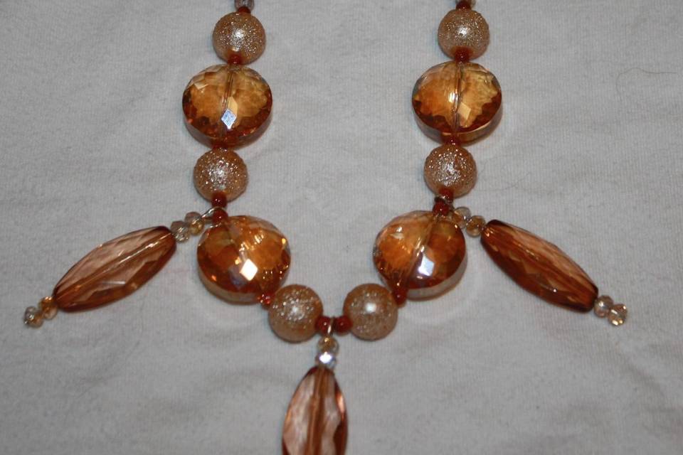 Custom design with unique combination of varying sizes of round faceted amber glass crystals and textured beige beaded necklace, earrings and bracelet for the Bride or bridal party in any style and length,at affordable prices. All Renee needs is YOUR wedding colors.