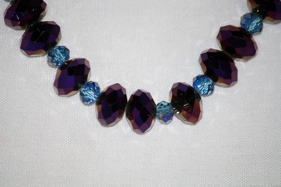 Custom design with unique combination of varying sizes of round faceted purple and blue glass crystalsfor beautiful beaded necklace, earrings and bracelet for the Bride or bridal party in any style and length,at affordable prices. All Renee needs is YOUR wedding colors.