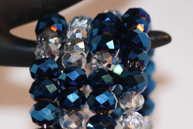 Custom design with unique combination of varying sizes of round faceted half silver half clear and aqua blue glass crystals for a beautiful beaded necklace, earrings and bracelet for the Bride or bridal party in any style and length,at affordable prices. All Renee needs is YOUR wedding colors.