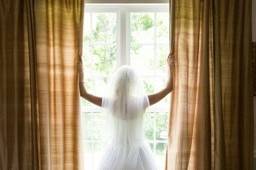 Bride by the windows