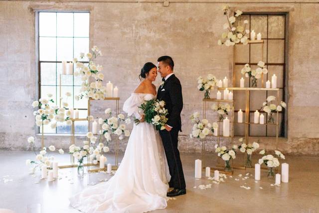 Bride and groom by florals