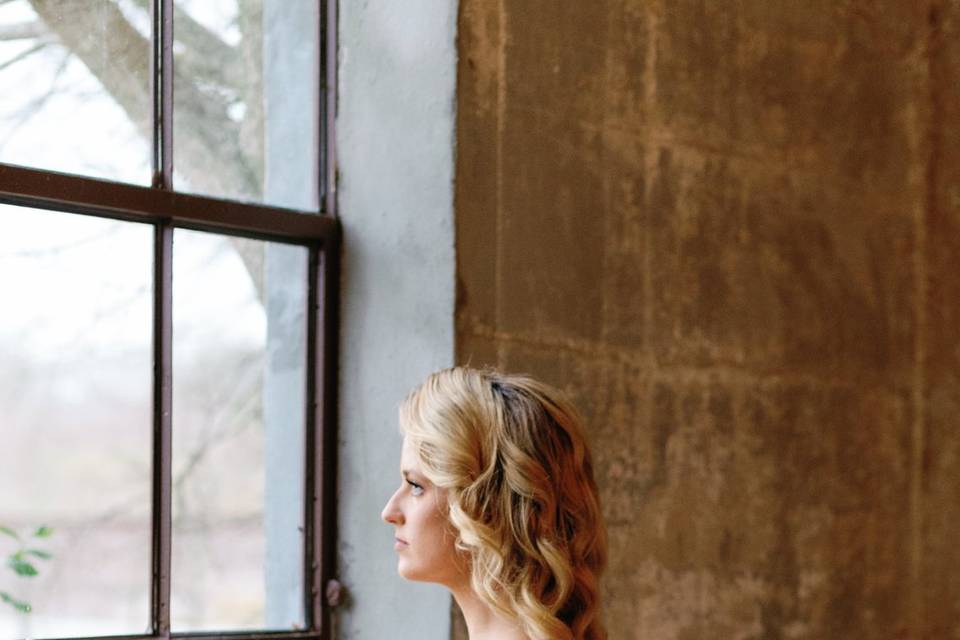 Bride looking out window