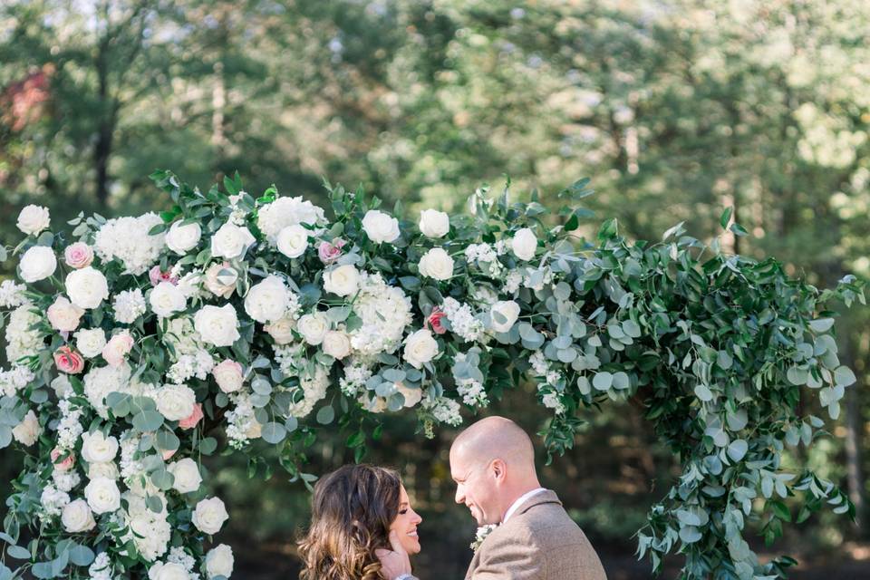 Ceremony under a flower arch