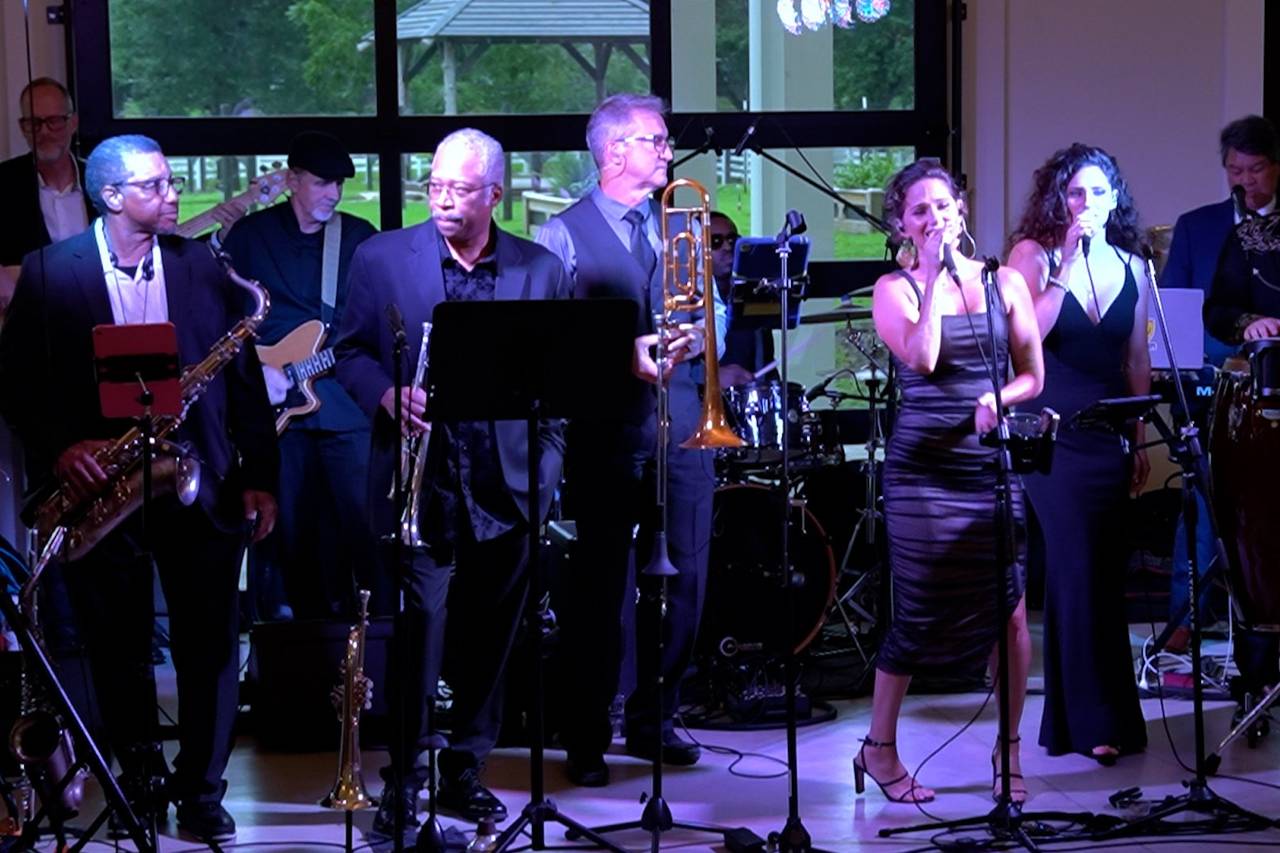 Full band with horns on stage