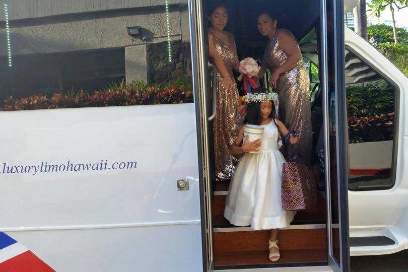 This flower girl is gonna talk about the limobus to all her classmates when she goes back to school!  No need to duck down.  Just walk right off the bus with ease when you book with Luxury Limo Hawaii.