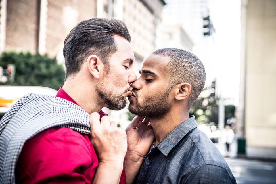 Grooms kissing