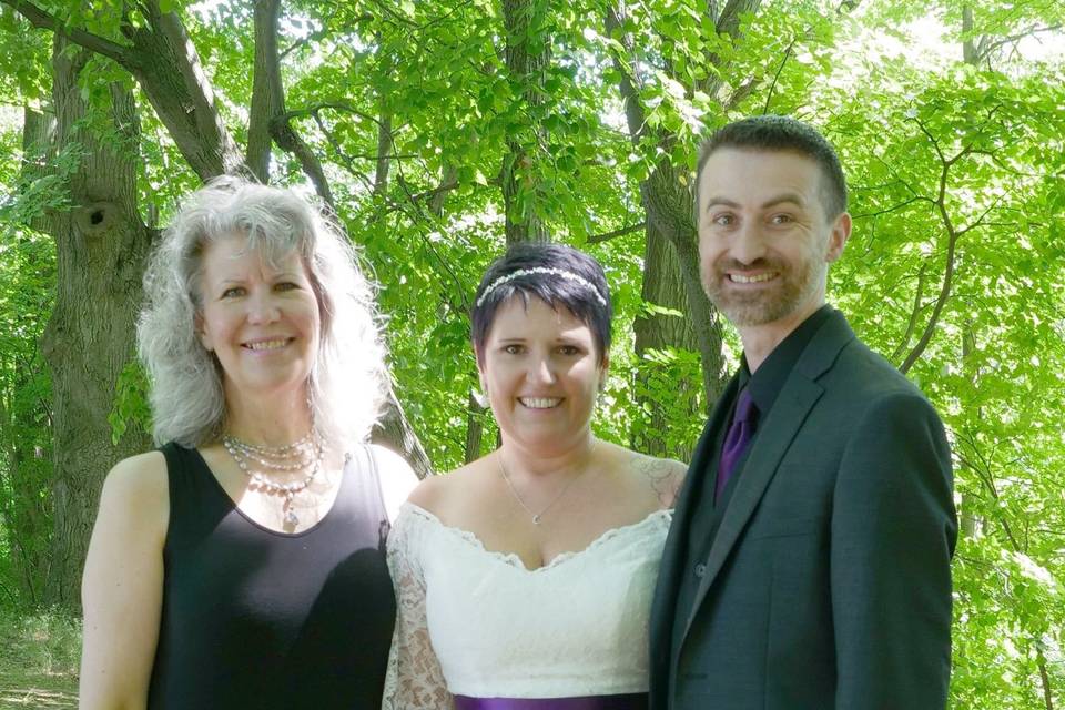 Officiant with the newlyweds