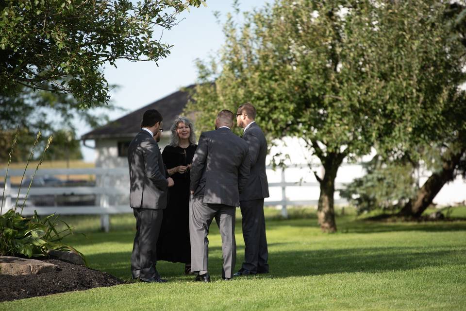 Officiant and groomsmen