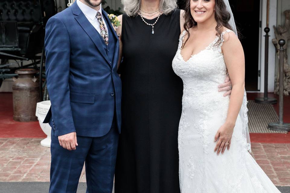 Newlywed Couple with Officiant