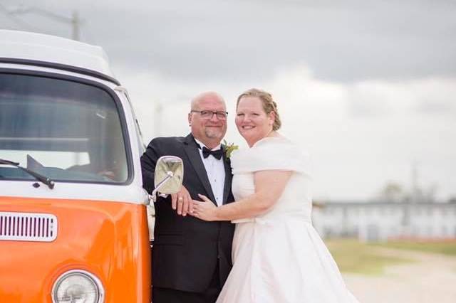 Bride and groom the the car