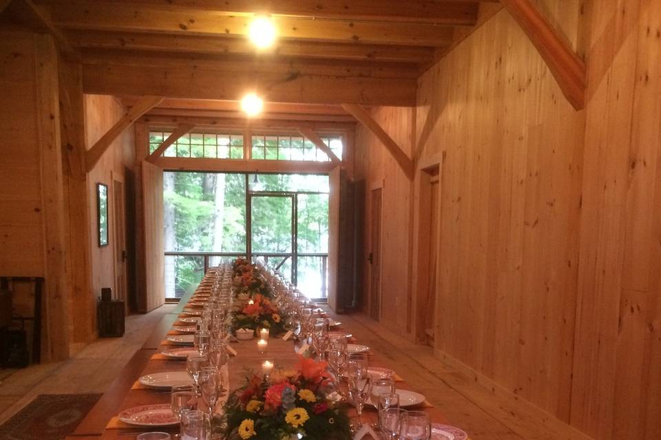 Indoor long table in a barn