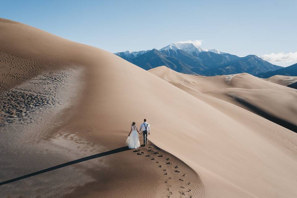 Couple hiking dunes