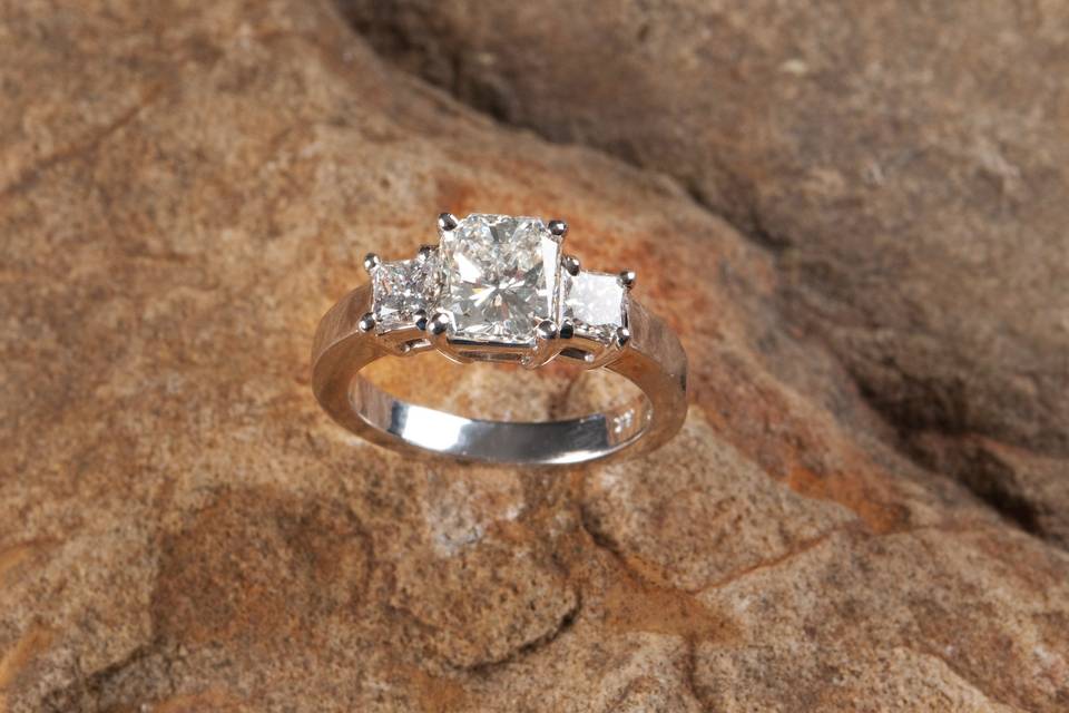 internally flawless three stone engagement ring in platinum custom designed and handmade by Secrète Fine Jewelry in Bethesda, MD and Washington, DC