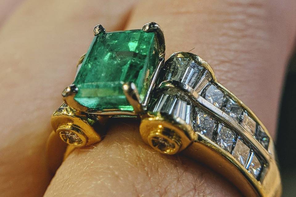 emerald and diamond engagement ring in 18k yellow gold custom designed and handmade by Secrète Fine Jewelry in Bethesda, MD and Washington, DC