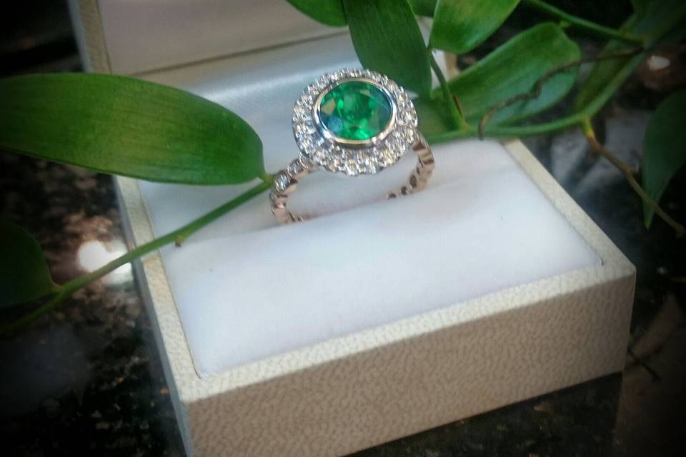 custom emerald and diamond ring with rose-gold shank by Secrète Fine Jewelry in Bethesda, MD and Washington, DC