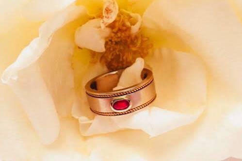 Rose gold and ruby men's wedding band  Secrète Fine Jewelry in Bethesda, MD and Washington, DC.