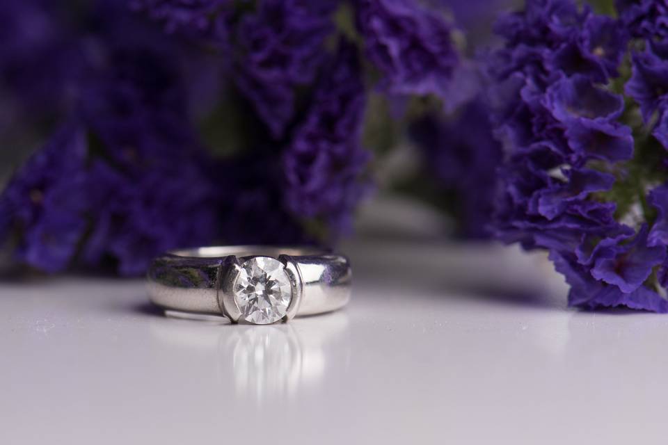 Diamond and platinum tension set engagement ring by  Secrète Fine Jewelry in Bethesda, MD and Washington, DC