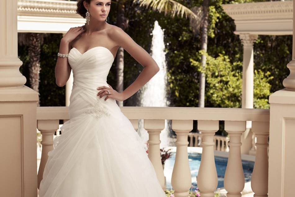 Style: 2109 Fit and flare silhouette with an Iridescent Organza ruched bodice. Sweetheart neckline with beaded appliqués on front and back bodice. Faux beaded buttons along the zipper.