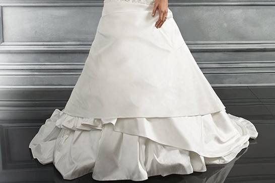 the gown is lace appliqués with buttons on the back bodice.