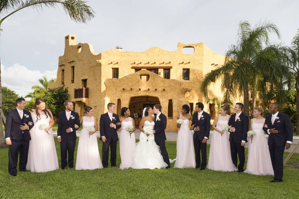 The couple with the bridesmaids and groomsmen