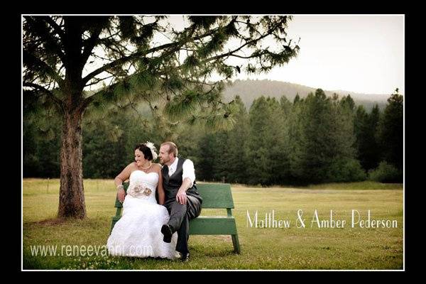 The bride and groom, Amber and Matt Pederson take a private moment from their party to enjoy a seat under a perfect tree.