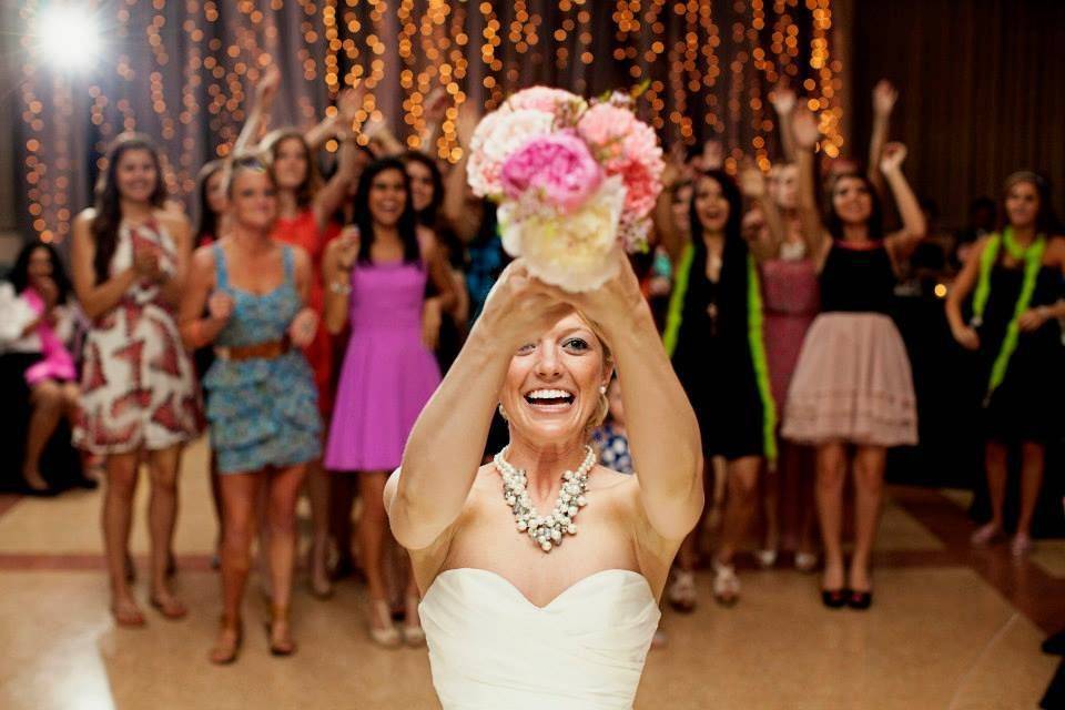 Bride tossing her bouquet