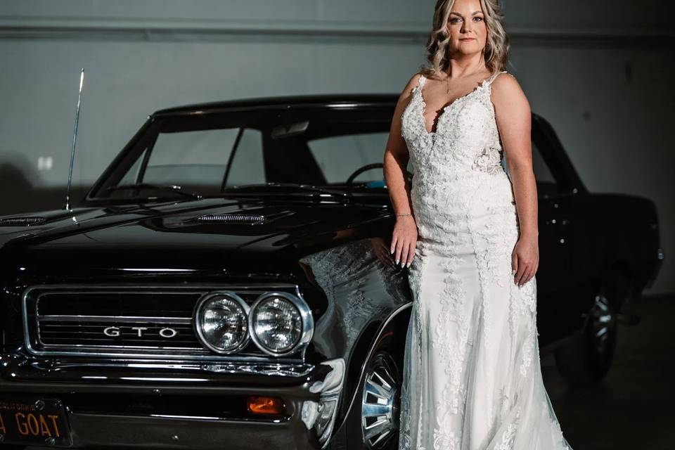 Bride with black car