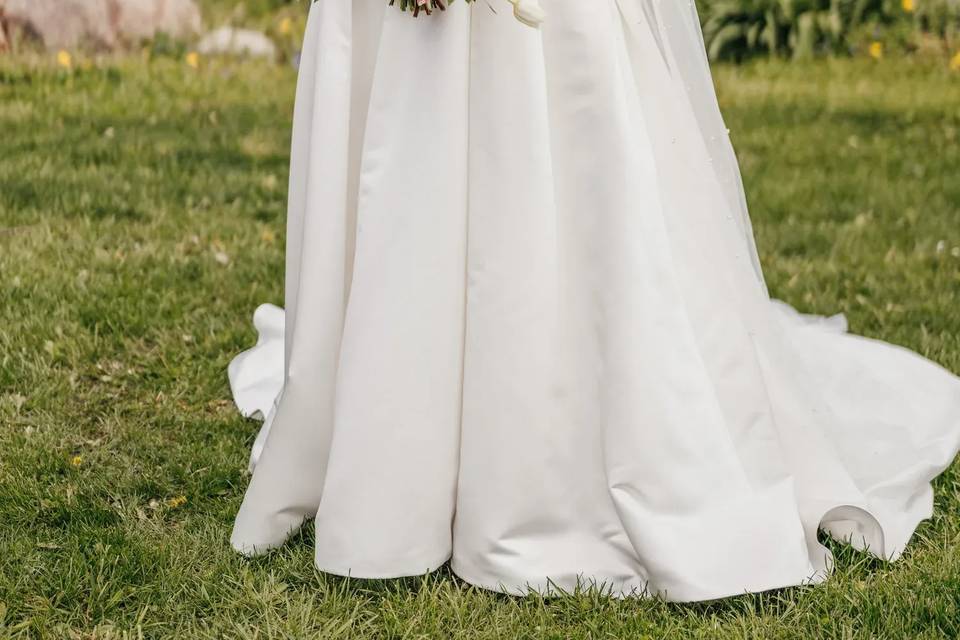 Bride standing flowers