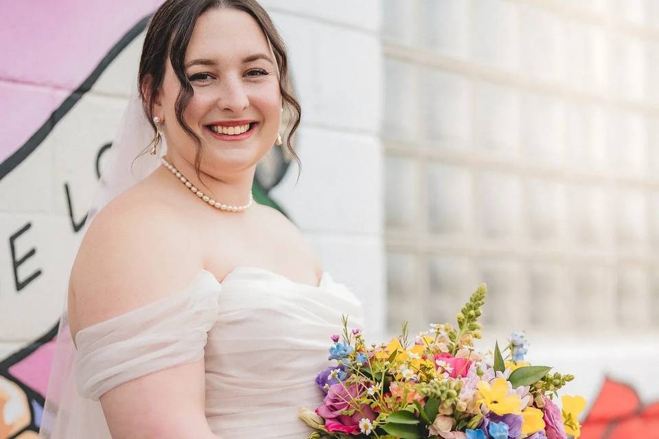 Bride with flowers smiling