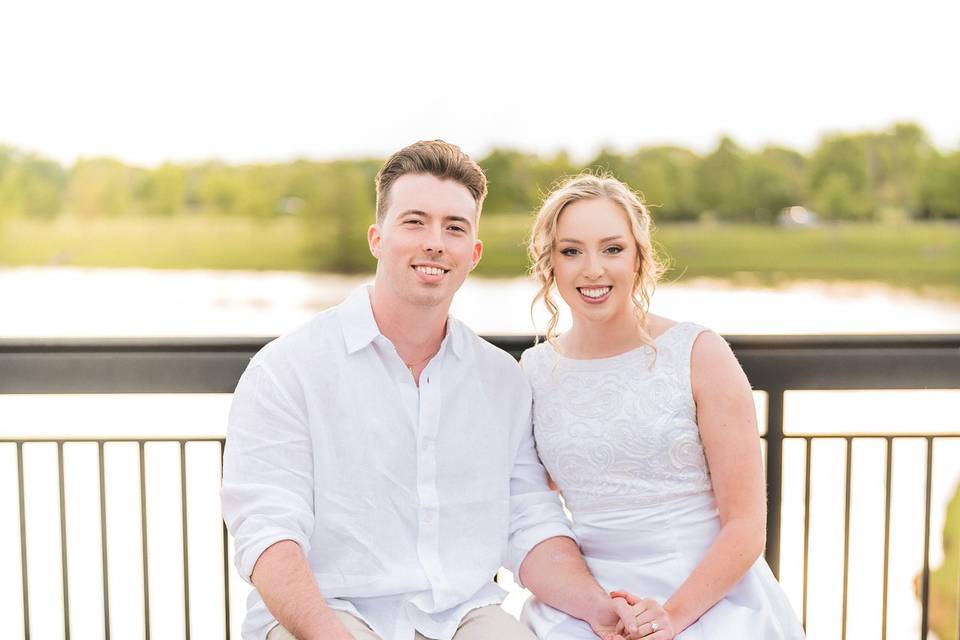 Bride and groom sitting on ben