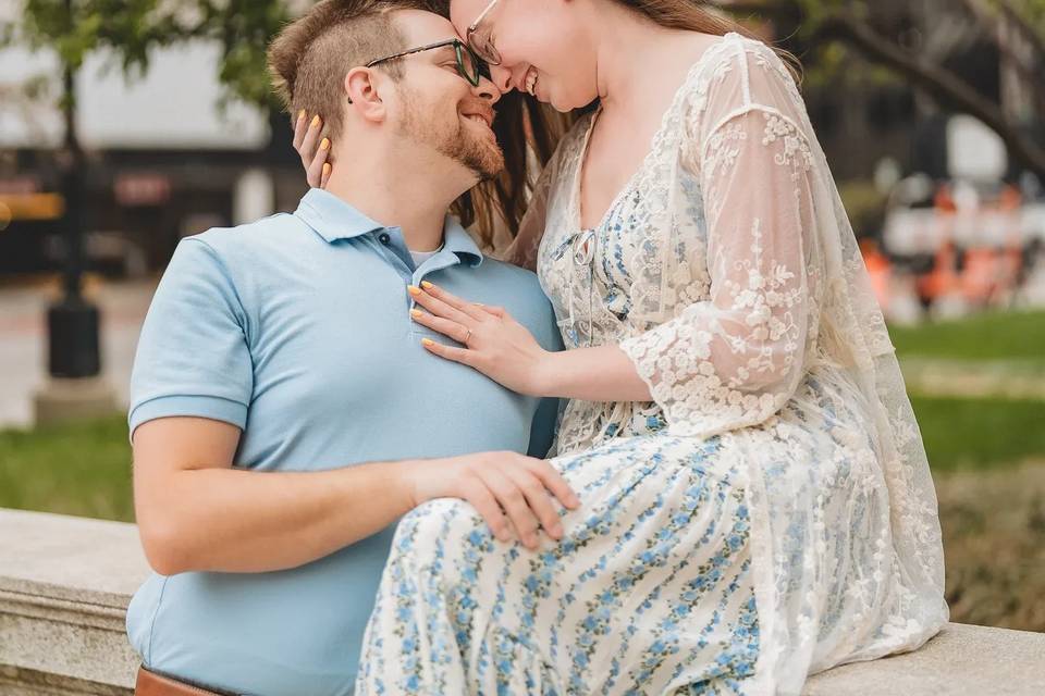 Bride sits on wall