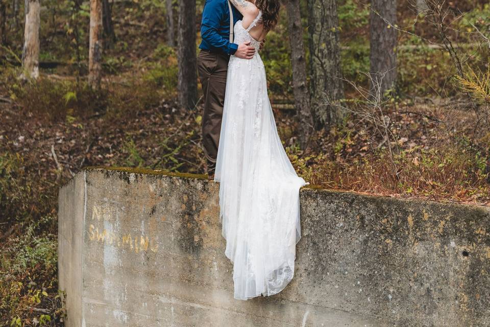 Bride and groom on dam wall