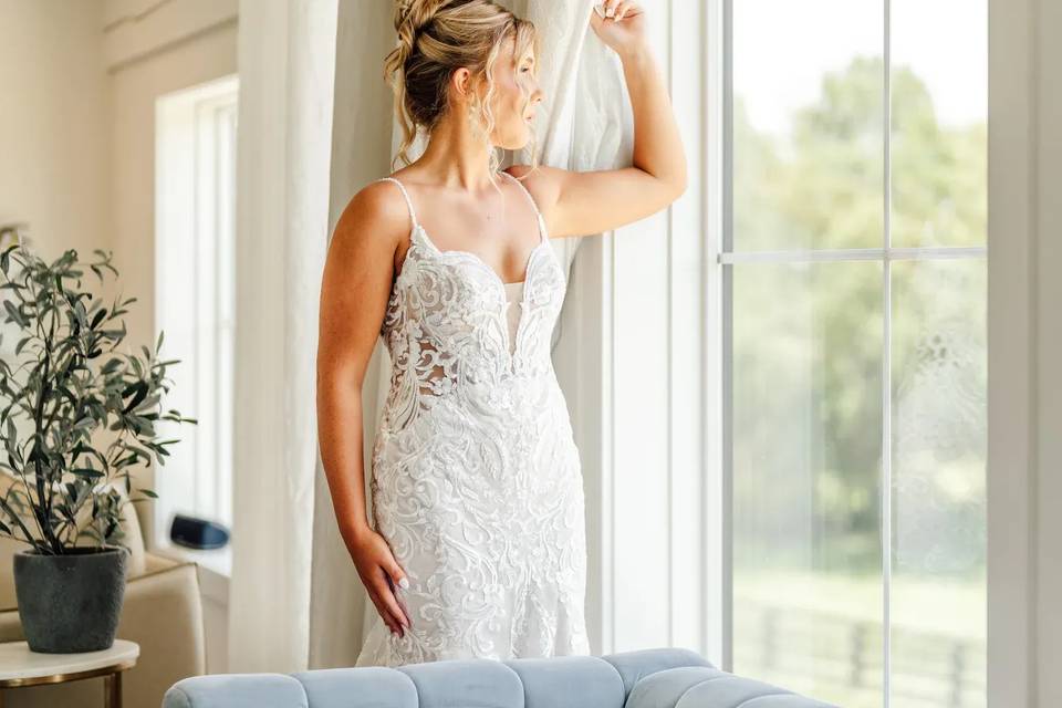 Bride looking out window