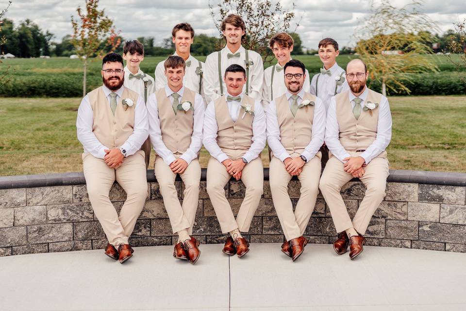 Groom and grooms men pose