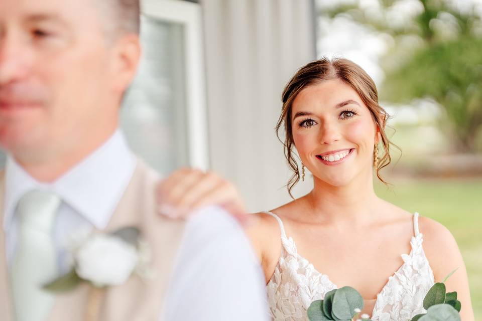 Bride behind groom first look