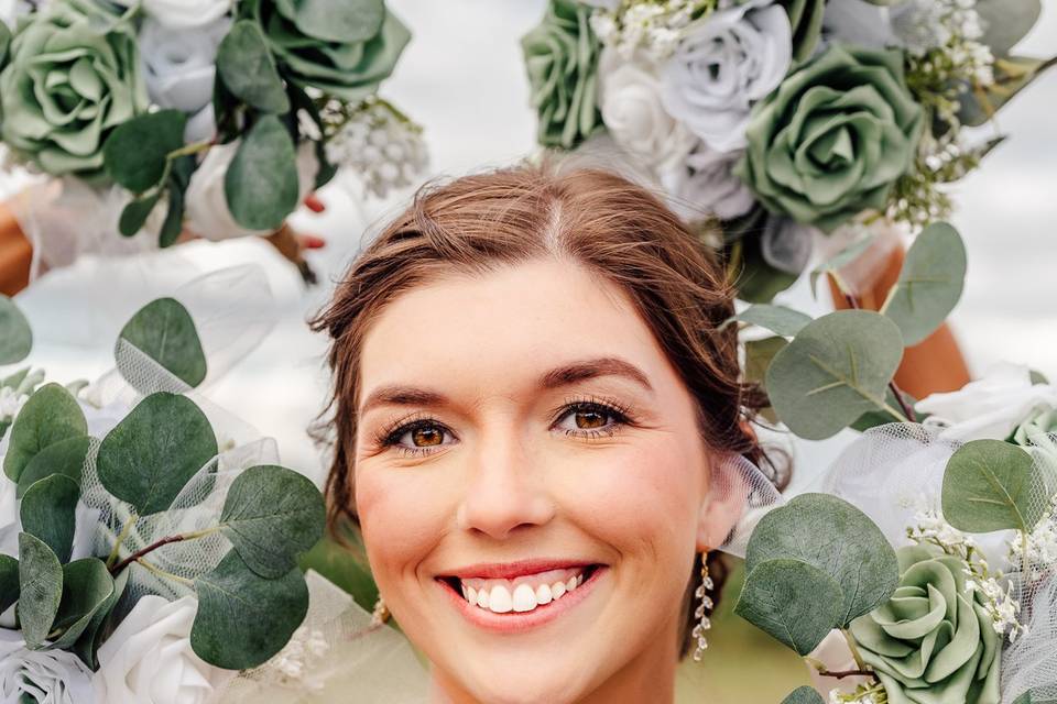 Bride surrounded by flowers