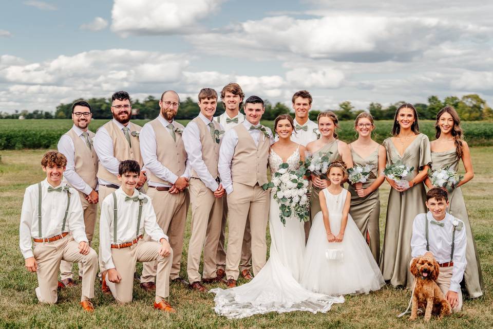 Entire wedding party at sunset