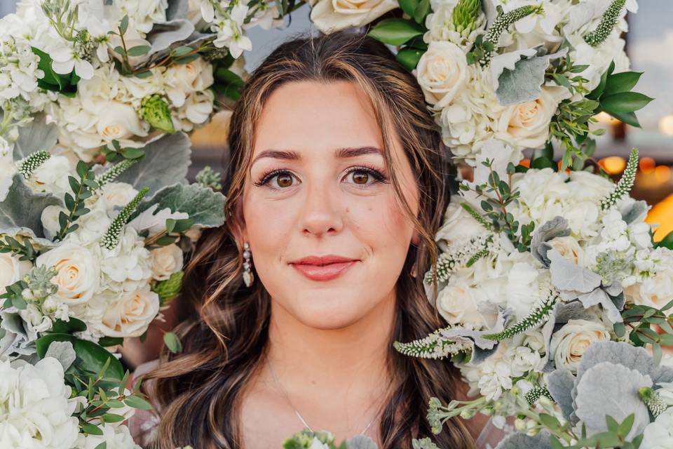 Bride surrounded by flowers