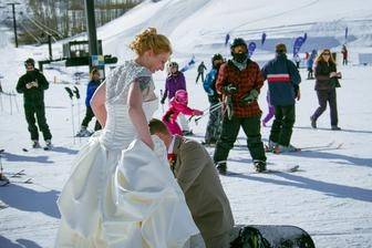 Skiing with her wedding dress on