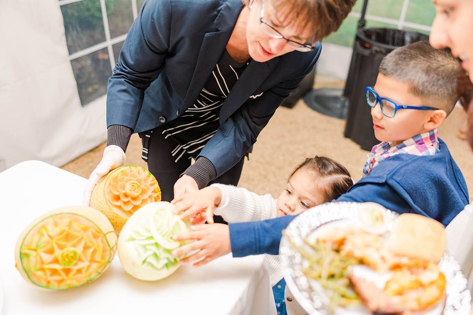 Children enjoying the carvings