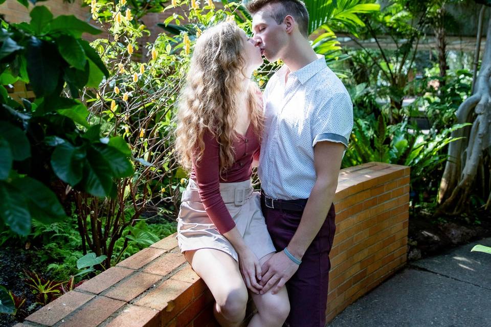 Engaged couple in arboretum