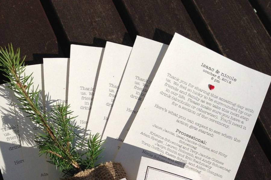 The couple designed and printed the ceremony programs themselves, and as favors they distributed tiny trees that will remind guests of their romantic wedding in the forest for years and years to come