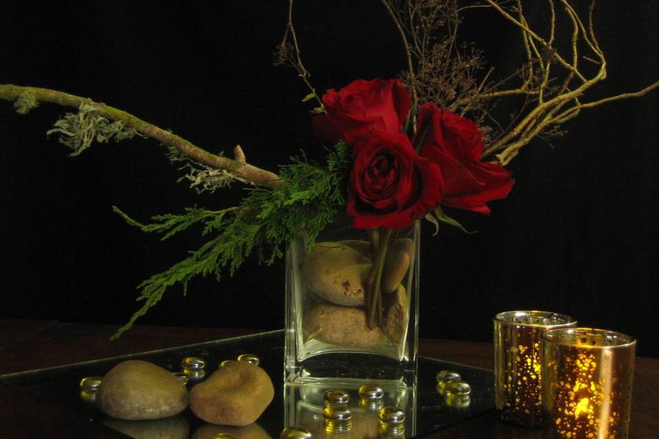 Dramatic centerpieces for the reception, by A Day Like No Other: branches, golden rocks, mirror glass, golden votives and black-red roses